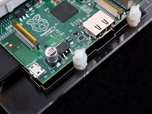 Demo Shot of the Board Edge Mounting Kit - Pack of 4, mounted on a Adafruit Pi Dish for Raspberry Pi 