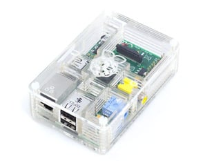 Angled shot of assembled clear acrylic enclosure for Raspberry Pi computer.