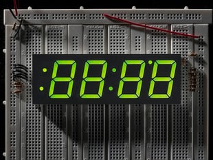 Huge green 7-segment clock display with all segments lit