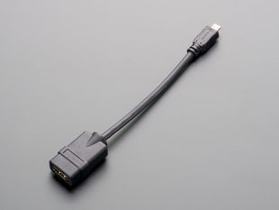 Angled shot of 7" long, black, micro-HDMI to HDMI socket adapter cable.
