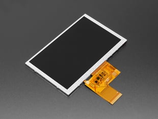 Angled shot of bare, rectangular TFT display with flex connector.