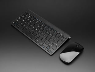 Angled Shot of the Black Wireless Keyboard and Mouse Combo with One USB Port!