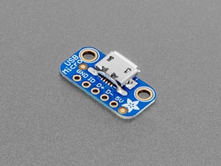 Angled shot of small, blue, rectangular USB micro-b breakout board.