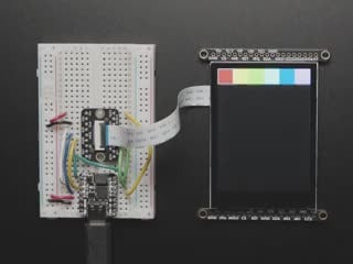 Top Down Demo Video of the 2.8"TFT LCD Breakout cabled to a QT Py on a breadboard. A red manicured finger draws a heart in red and purple.