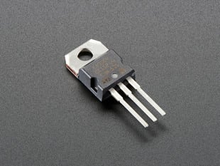 Chunky 3-pronged voltage regulator.
