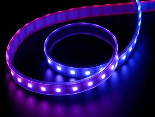 Angled shot of LED strip emitting purple and red lights.
