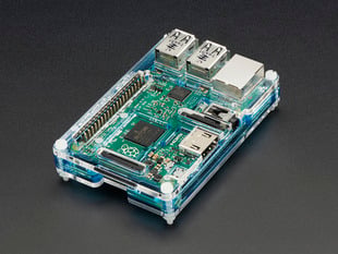 Angled shot of assembled translucent blue Pibow Coupé Flotilla - Enclosure for Pi 2/B+/Pi 3.