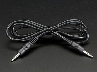 Black audio cable with 3.5mm audio jacks wrapped like a bow tie.