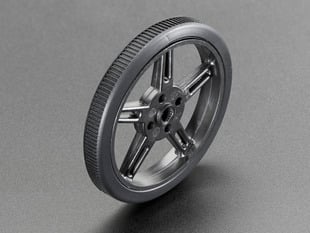Angled shot of a small, black, plastic micro servo wheel.