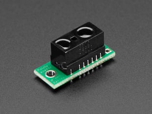 Angled shot of a Sharp GP2Y0D805Z0F Digital Distance Sensor with Pololu Carrier. 