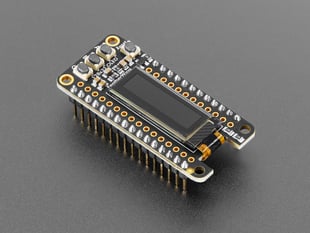 Angled shot of black, rectangular, OLED display breakout with headers.