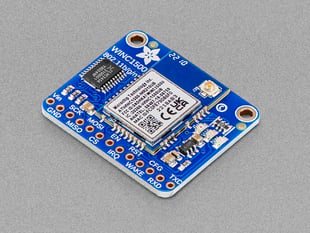 Blue, square-shaped WiFi breakout board.