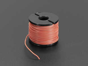 A spool of light red AWG wire.