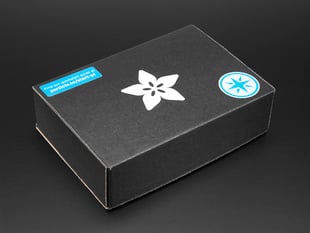 Angled shot of a black box with the white Adafruit star-flower logo.