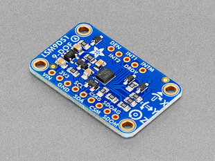 Angled shot of blue, rectangle-shaped 9-DOF breakout board.