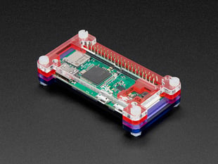 Angled shot of an assembled Pibow Zero W Case on a Raspberry Pi Zero. 