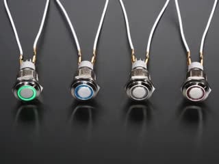 Topdown video of four rugged metal pushbutton with LED rings. the LED rings change colors in sequence.