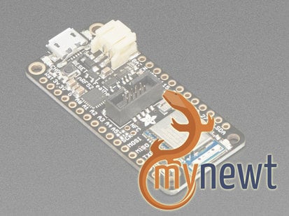 Faded image of a rectangular microcontroller and text that reads "my newt".