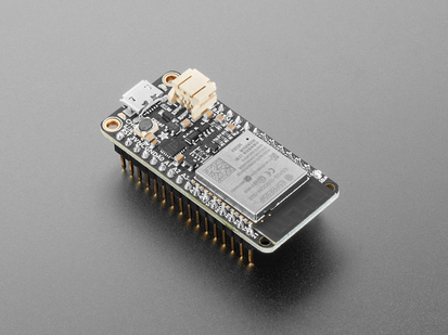 Angled Shot of the Adafruit HUZZAH32 &ndash; ESP32 Feather Board (pre-soldered).