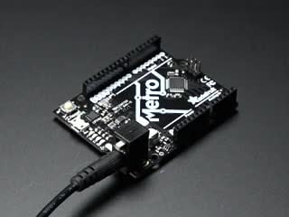 Demo Video Showing a hand move the switch on the 2.1mm DC Power Jack with Slide Switch and powering the Metro board it's connected to.