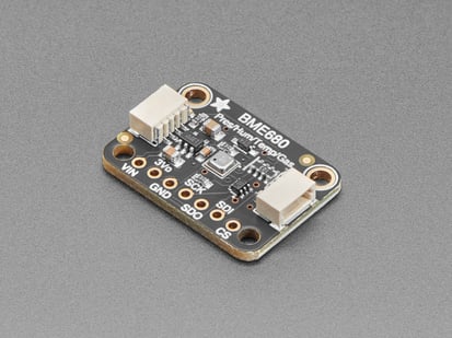 Angled shot of black, square-shaped pressure-humidity-temperature-gas sensor breakout.