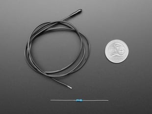 Black wire with epoxy nub end alongside a resistor next to US quarter for scale.