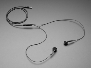 Black, wired earbuds semi-coiled.