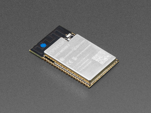 Angled shot of rectangular Wi-Fi module with castellated pads.