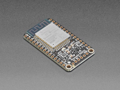 Angled shot of Adafruit HUZZAH32 &ndash; ESP32 Breakout Board. 