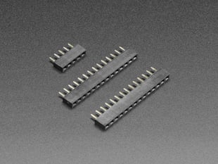 Angled shot of two short 14-pin socket headers and one short 5-pin socket headers.