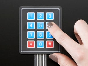 Finger pressing one key of 3x4 keypad
