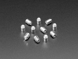 Angled shot of ten 6mm tall M3 standoff nuts.