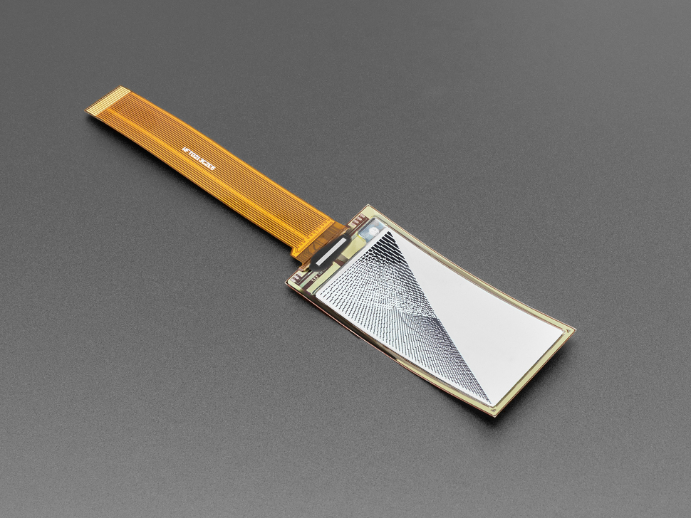 Angled shot of 2.13" monochrome flexible electronic ink display with long ribbon cable with black and white triangles graphic.