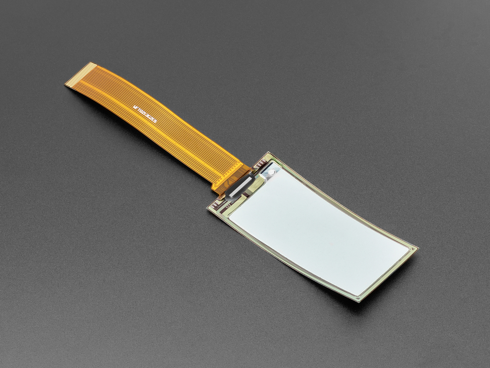 Angled shot of 2.13" monochrome flexible electronic ink display with long ribbon cable.