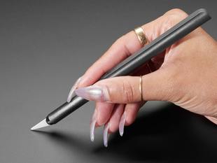 Hand holding Craft Knife with Ceramic Blade