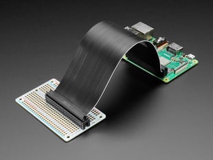 Angled shot of an assembled Adafruit Perma-Proto 40-Pin Raspberry Pi Half-Size PCB with Raspberry Pi computer.