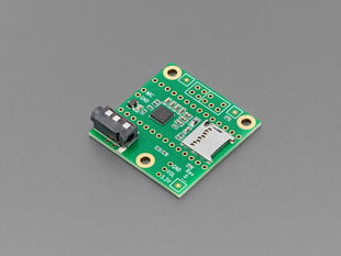 Angled shot of green, square-shaped audio breakout board.