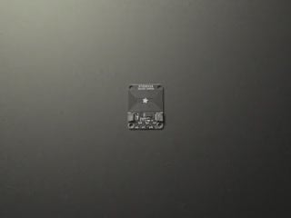 Hand brings phone close to breakout board, and shows phone recognizing an RFID tag
