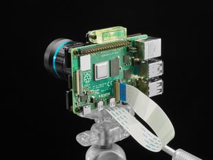 Assembled Raspberry Pi 4 with HQ camera on acrylic mounting plate on a flexible tripod.
