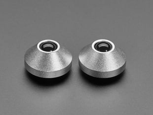 Angled shot of two silver aluminum bumper feet.