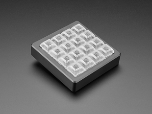 Angled shot of assembled 4x4 keypad shell with Kailh key switches and clear keycaps.