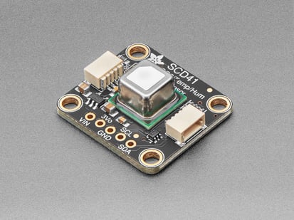 Angled shot of Adafruit SCD-41 - NDIR CO2 Temperature and Humidity Sensor.