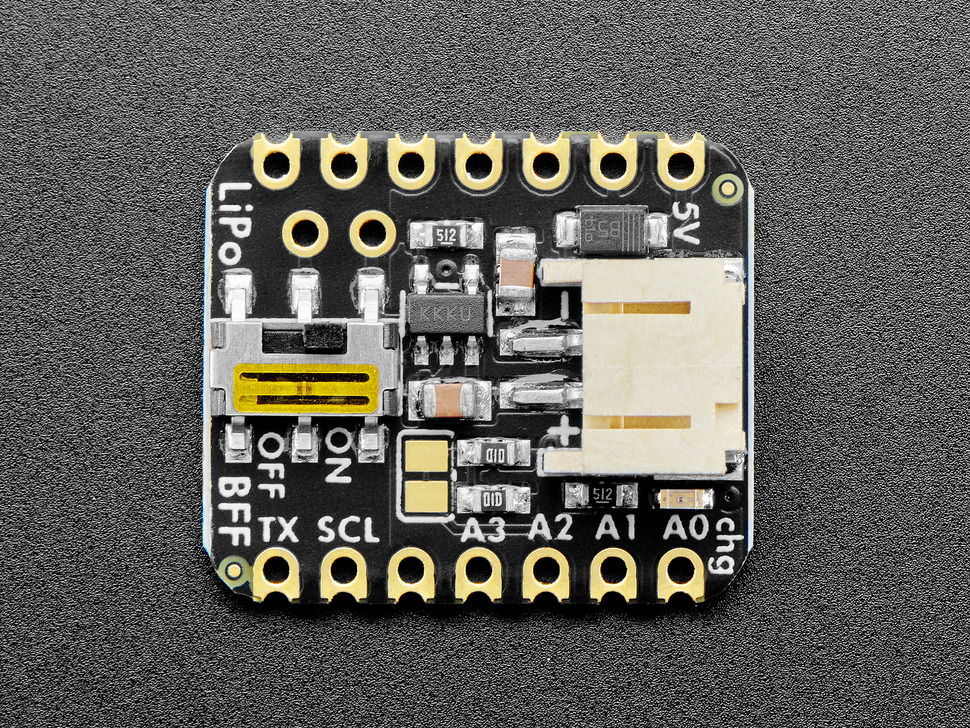 Top view of small, black, square-shaped breakout board.