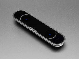 Overhead shot of long, thin, black, oval-shaped motion tracking camera.