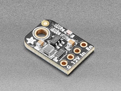 Angled shot of small, black, rectangular boost converter breakout board.