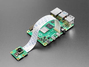 Angled shot of camera module assembled onto a Raspberry Pi 4 computer.