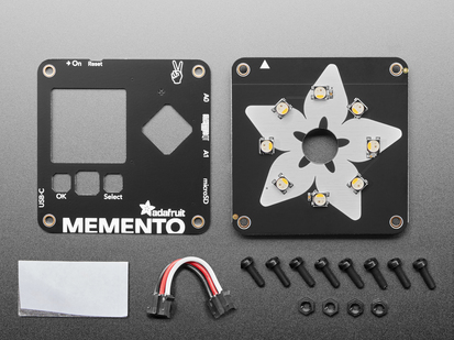 Overhead shot of two square-shaped PCB boards for a DIY camera above eight black plastic screws and four black plastic hex nuts with 3pin to 3pin JST PH cable and adhesive sticker.