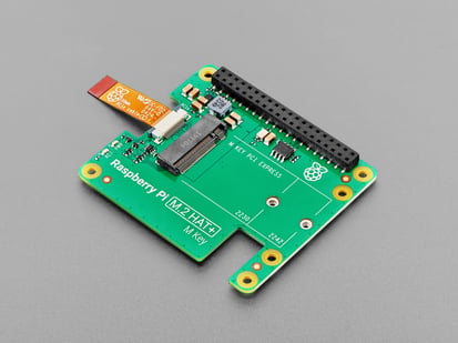 angled shot of green, rectangular add-on board with short FPC ribbon cable.