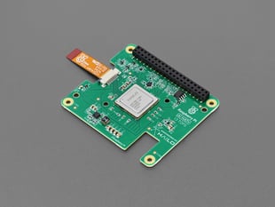 Angled shot of green, square-shaped add-on board.