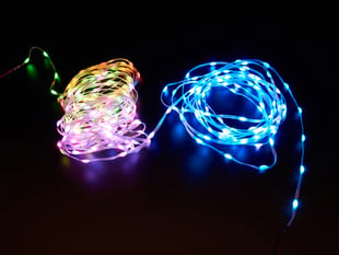 Pebble strand LED strips lit up yellow-pink and blue.